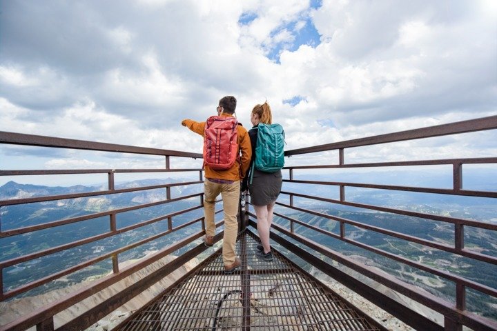 A couple looks at the view from atop Lone Mountain.